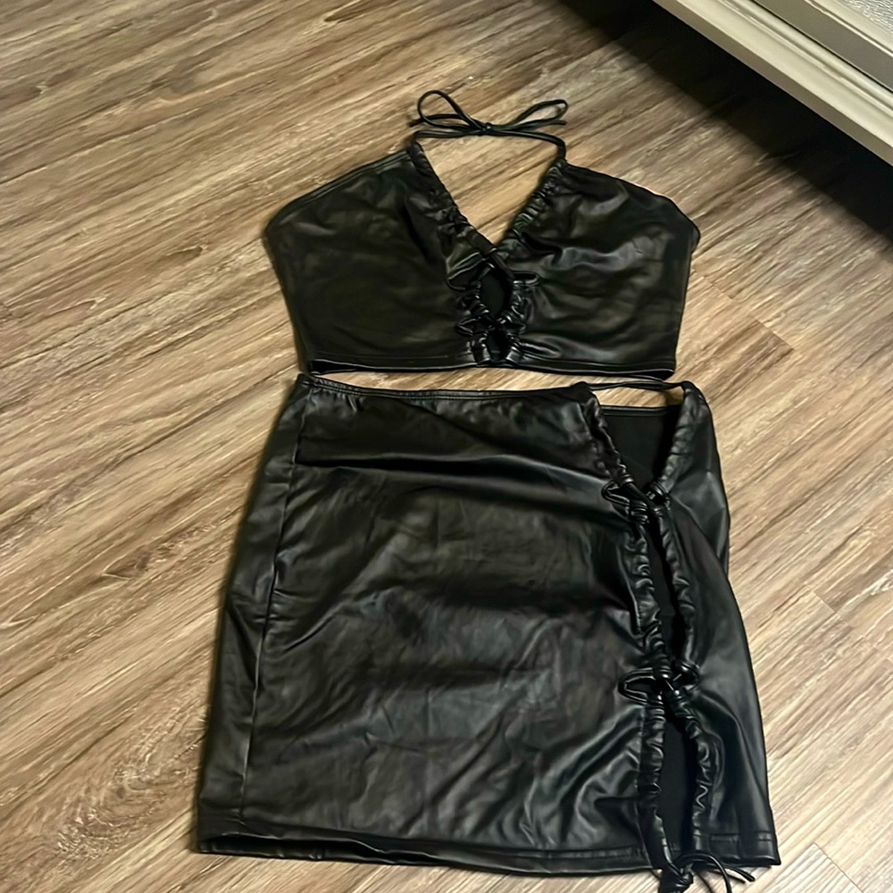 I’m selling a two peace black silk skirt with the silk crop top size L-large